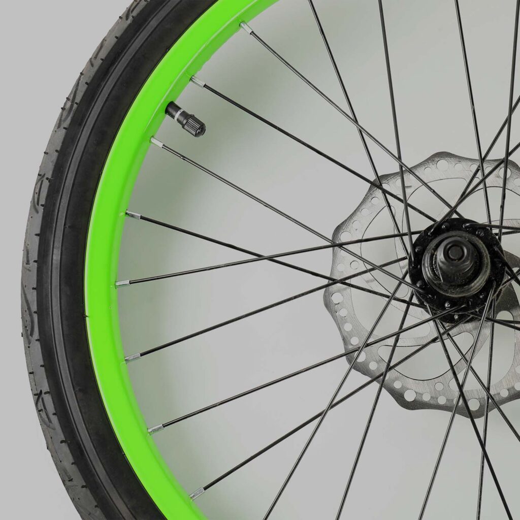 Bicycle wheel with spokes and disc brake rotor during professional wheel inspection and servicing - eMotoX Sports