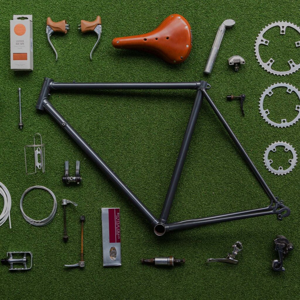 Bicycle frame and components laid our for professional bike servicing and assembly. | eMotoX Sports
